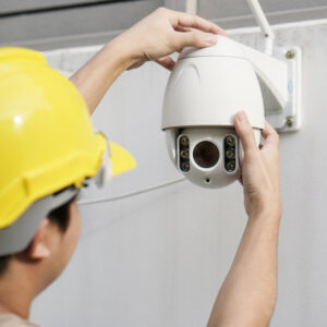 close-up-male-technician-fixing-cctv-camera-wall.jpg